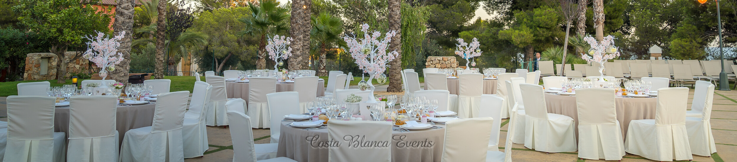 Photo of round wedding tables set for a wedding in Spain